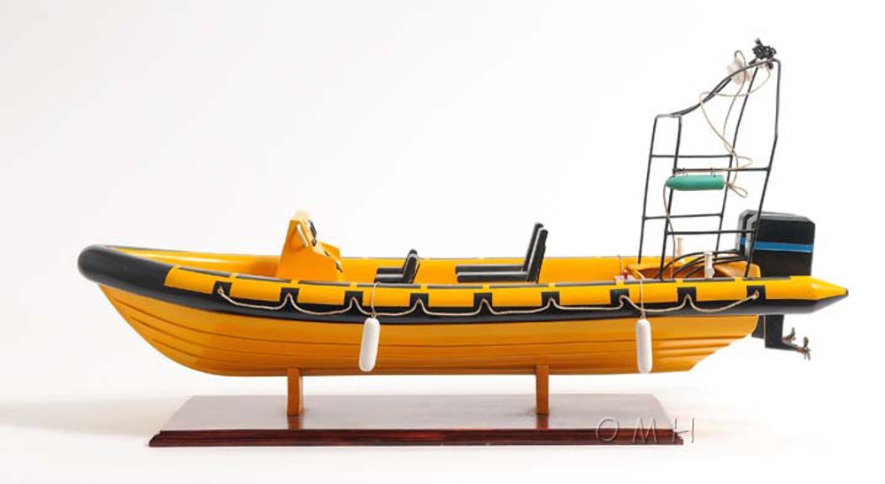 13" Unfinished Wood Hand Painted Model Boat. Home product isolated on a plain white background, showing a orange wood surface.