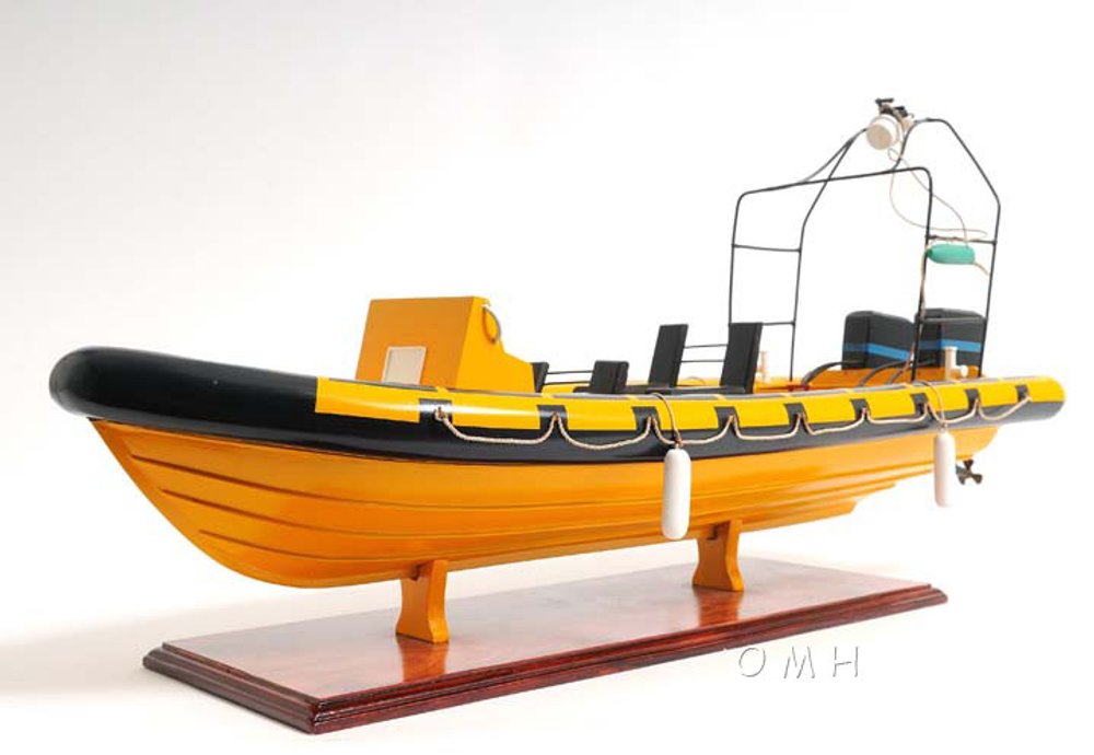 13" Unfinished Wood Hand Painted Model Boat. Home product isolated on a plain white background, showing a orange wood surface.