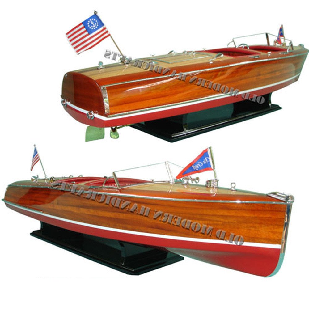 10" Unfinished Wood Hand Painted Model Boat. Home product isolated on a plain white background, showing a burgundy wood surface.