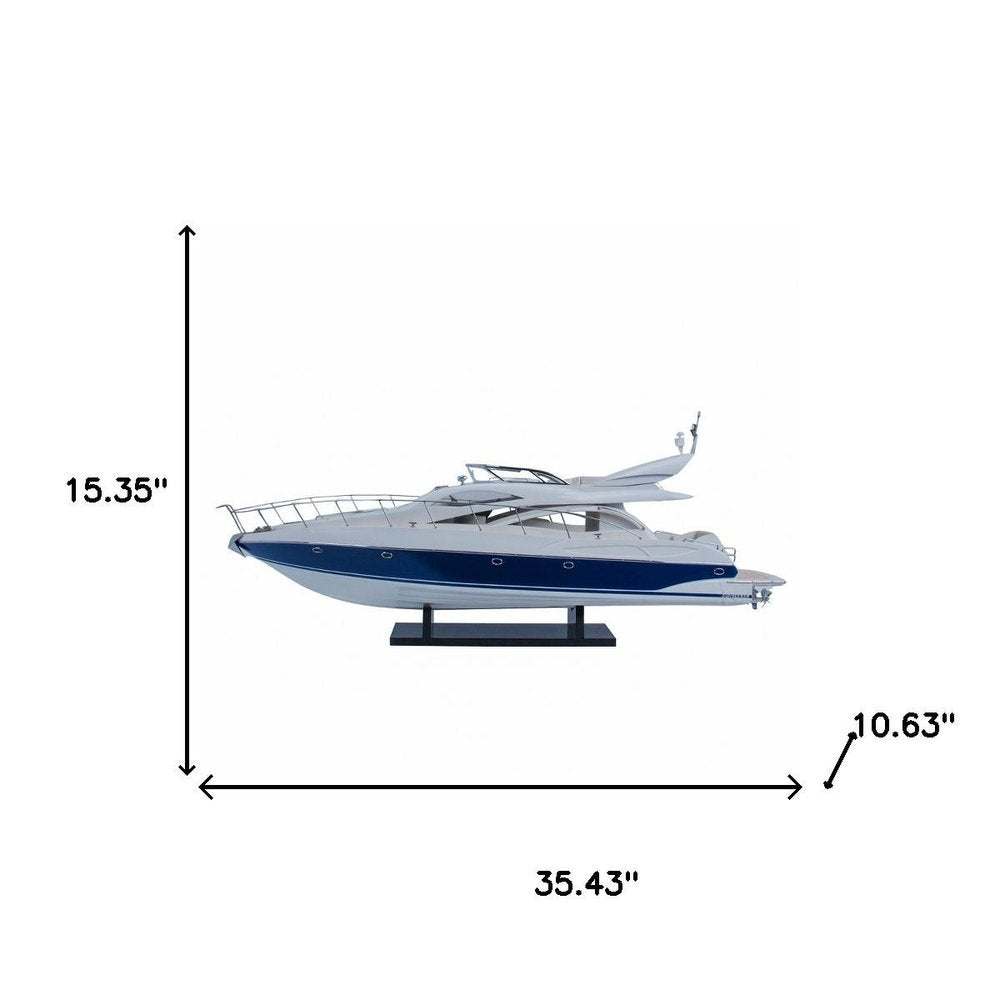 15" Unfinished Wood Hand Painted Model Boat. Home product isolated on a plain white background, finished in blue wood.