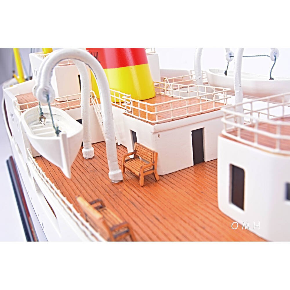 12" Unfinished Wood Hand Painted Model Boat. Home product isolated on a plain white background, finished in blush wood.