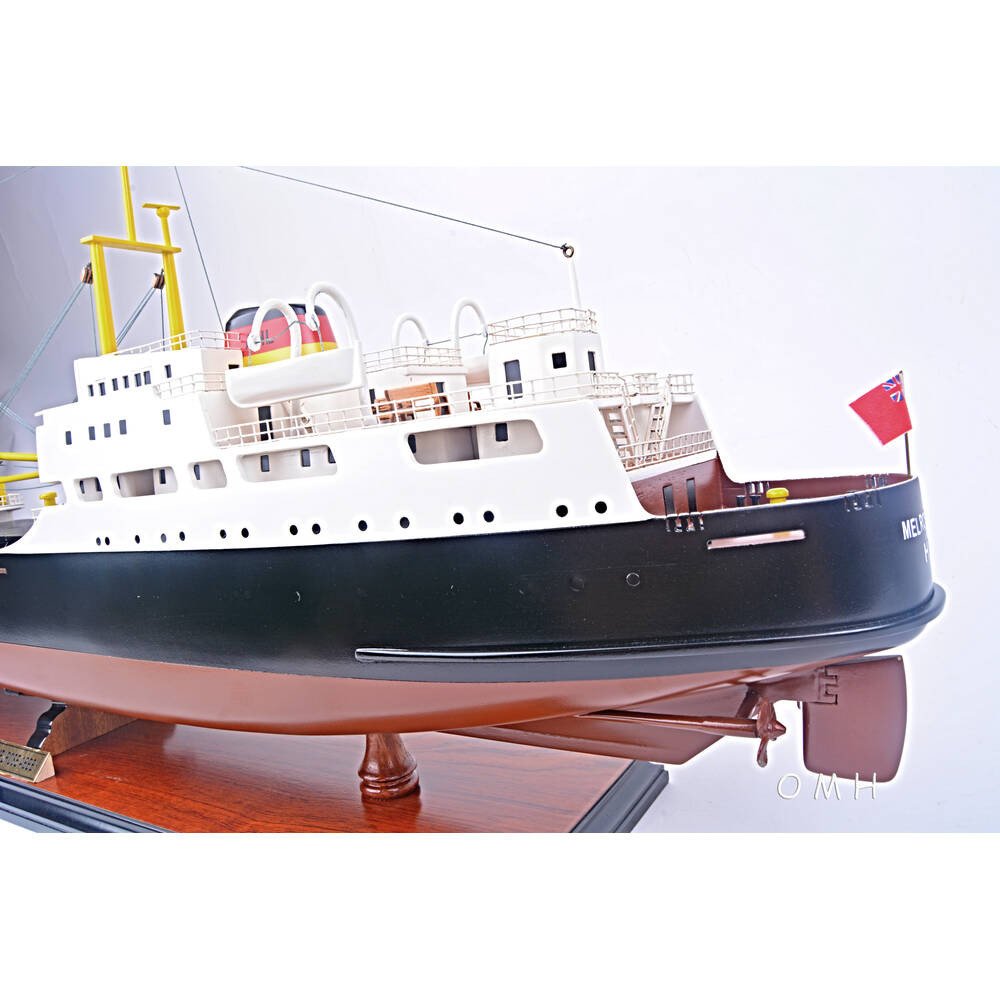 12" Unfinished Wood Hand Painted Model Boat. Home product isolated on a plain white background, finished in blue wood.