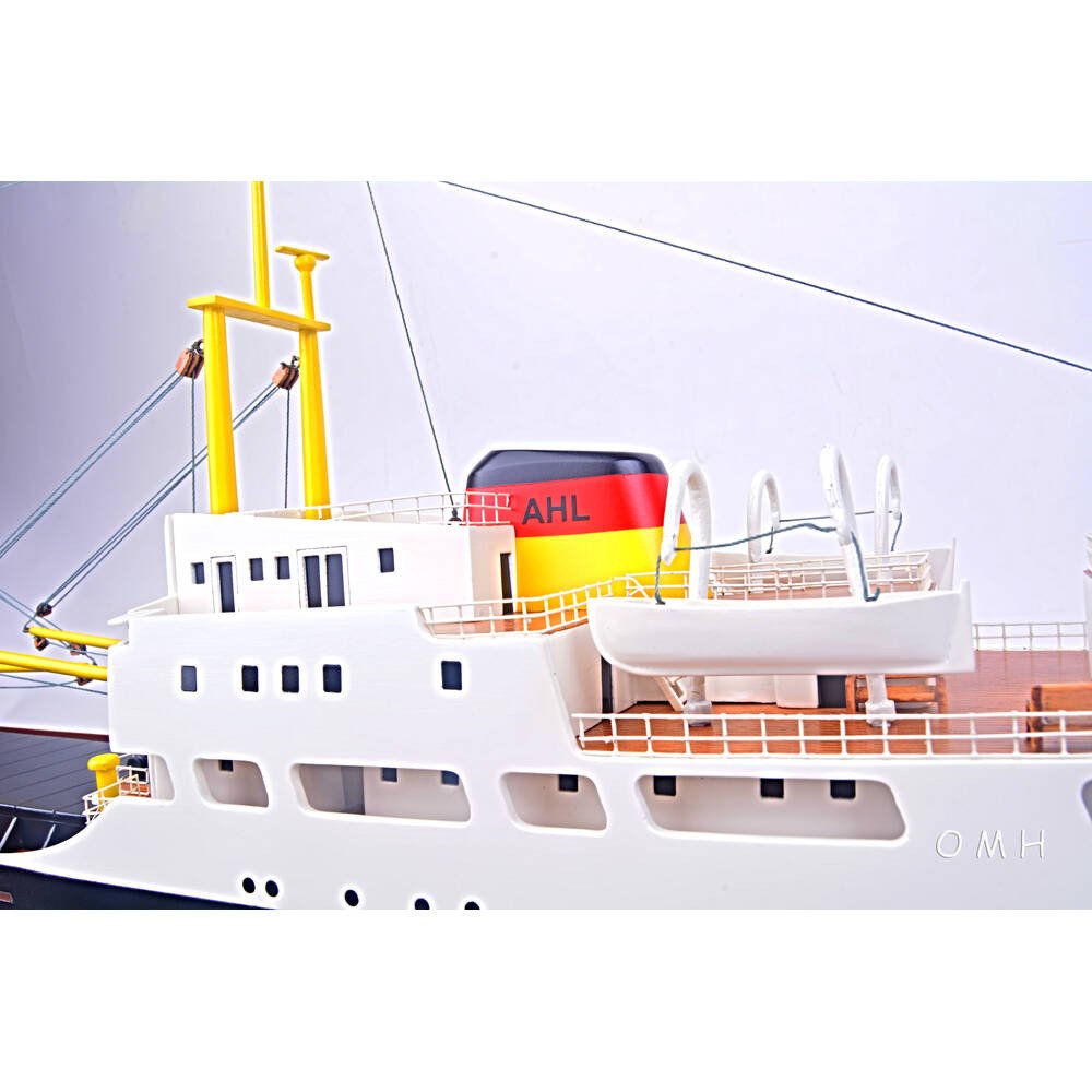 12" Unfinished Wood Hand Painted Model Boat. Home product isolated on a plain white background, showing a blue wood surface.