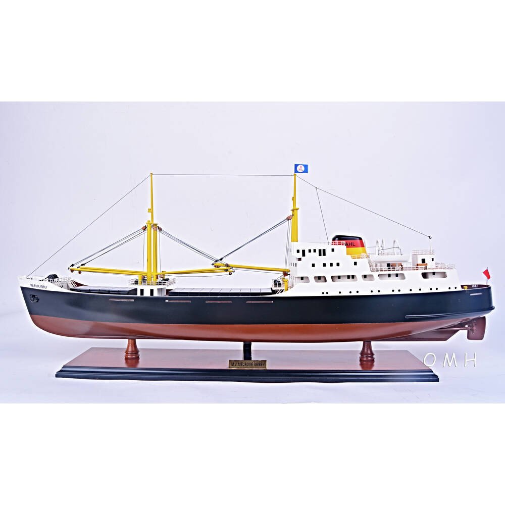 12" Unfinished Wood Hand Painted Model Boat. Home product isolated on a plain white background, finished in blue wood.