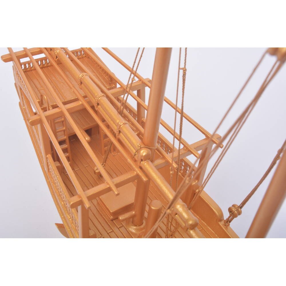 11" Unfinished Wood Hand Painted Model Boat. Home product isolated on a plain white background, showing a orange wood surface.