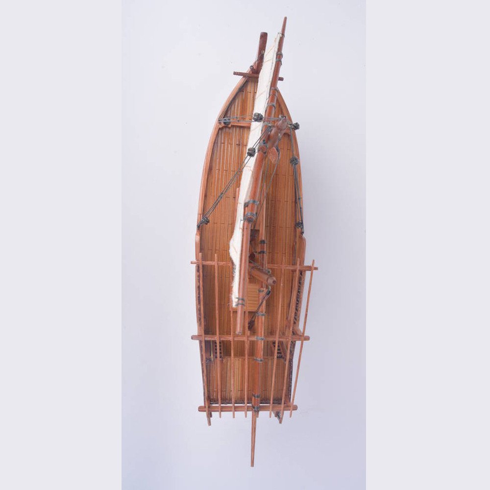 11" Unfinished Wood Hand Painted Model Boat. Home product isolated on a plain white background, in a brown wood finish.