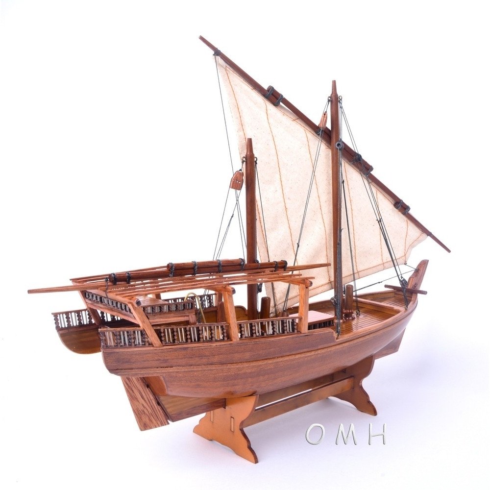 11" Unfinished Wood Hand Painted Model Boat. Home product isolated on a plain white background, finished in brown wood.