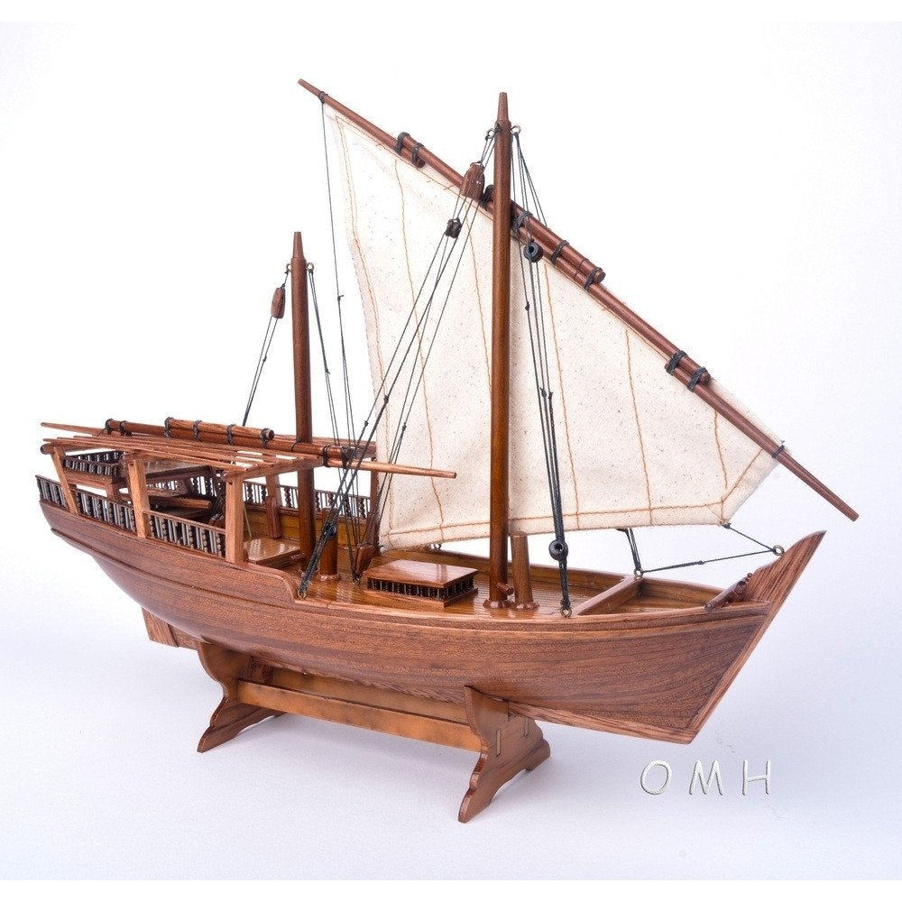 11" Unfinished Wood Hand Painted Model Boat. Home product isolated on a plain white background, showing a brown wood surface.