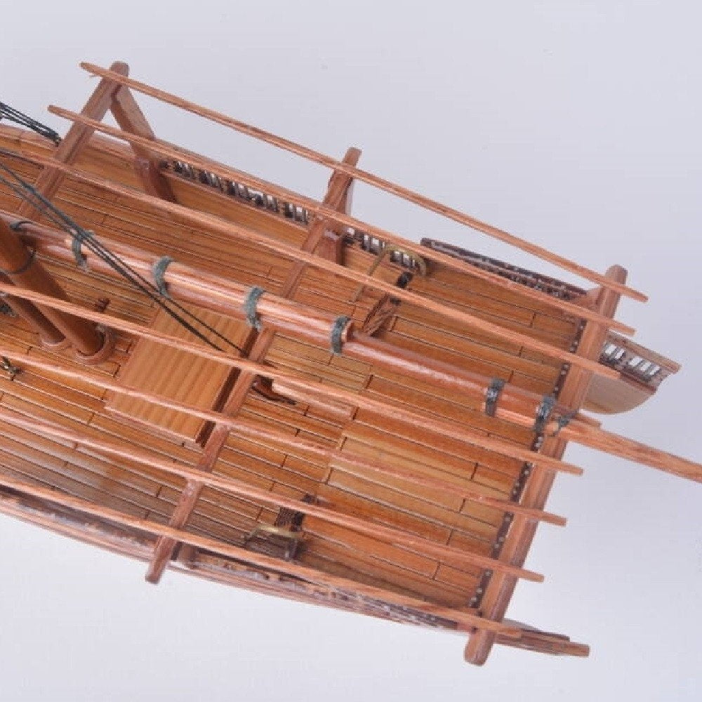11" Unfinished Wood Hand Painted Model Boat. Home product isolated on a plain white background, in a brown wood finish.