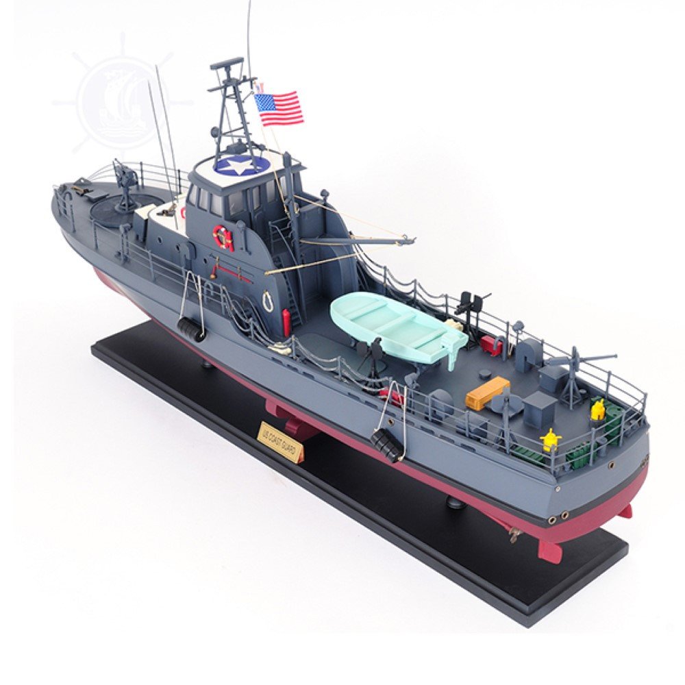 17" Unfinished Wood Hand Painted Model Boat. Home product isolated on a plain white background, showing a blue wood surface.