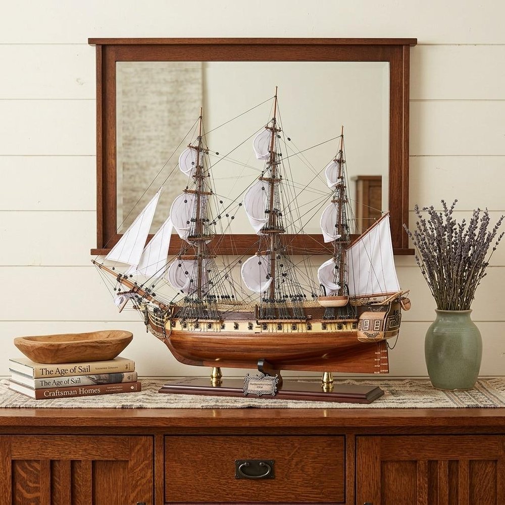 25" Unfinished Wood Hand Painted Model Boat styled in a furnished interior with a cream wall on a dark wood floor in dark brown wood.