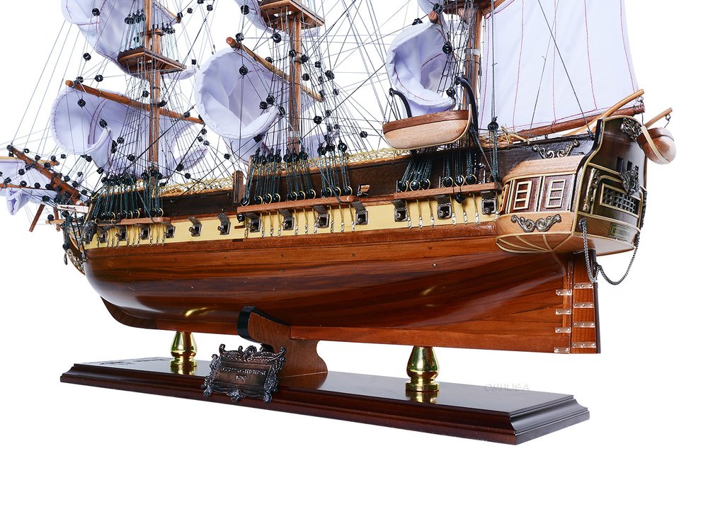 25" Unfinished Wood Hand Painted Model Boat. Home product isolated on a plain white background, finished in dark brown wood.
