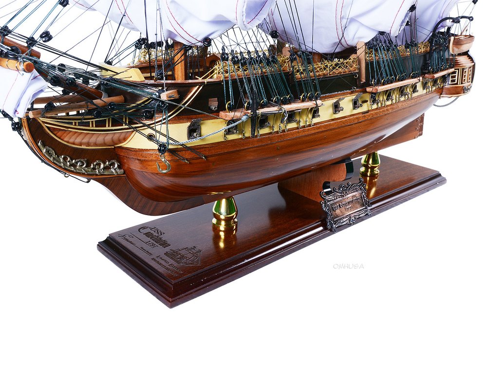 25" Unfinished Wood Hand Painted Model Boat. Home product isolated on a plain white background, finished in dark brown wood.
