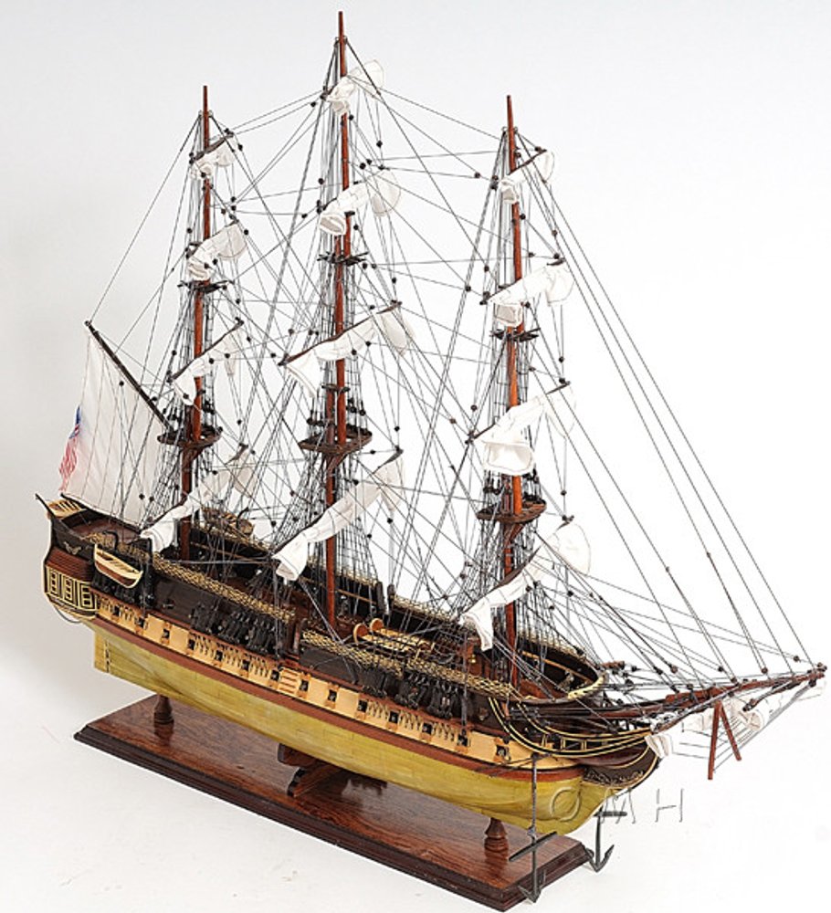 13" Unfinished Wood Hand Painted Model Boat. Home product isolated on a plain white background, showing a light gray wood surface.