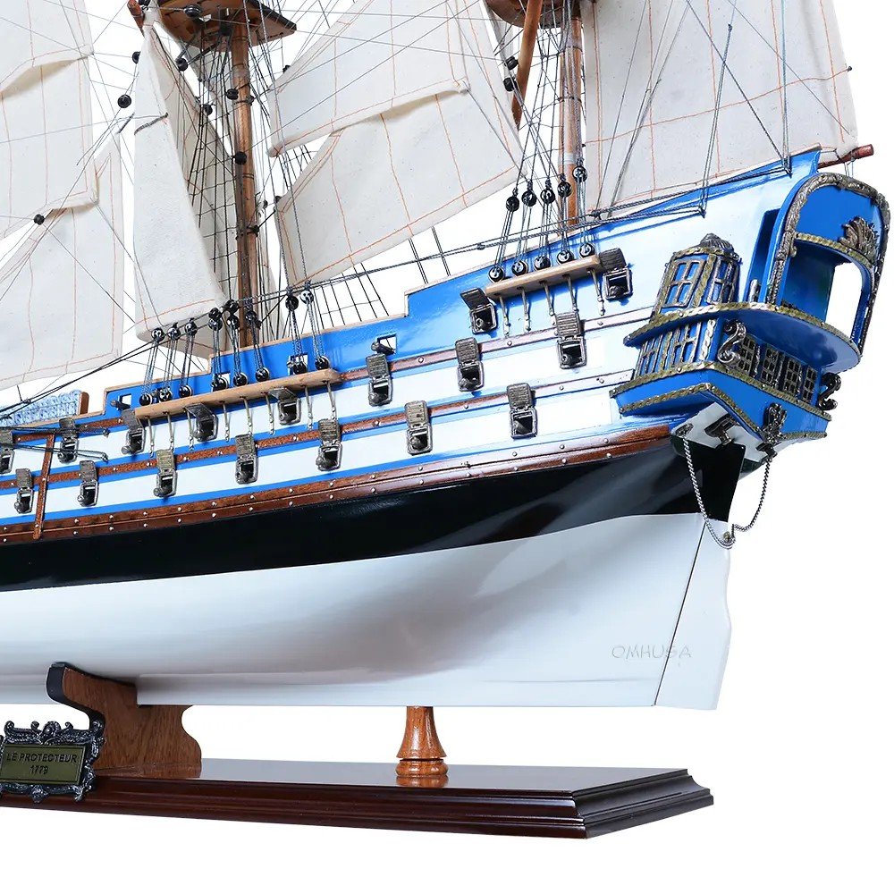 23" Unfinished Wood Hand Painted Boat Model Boat. Home product isolated on a plain white background, finished in blue wood.