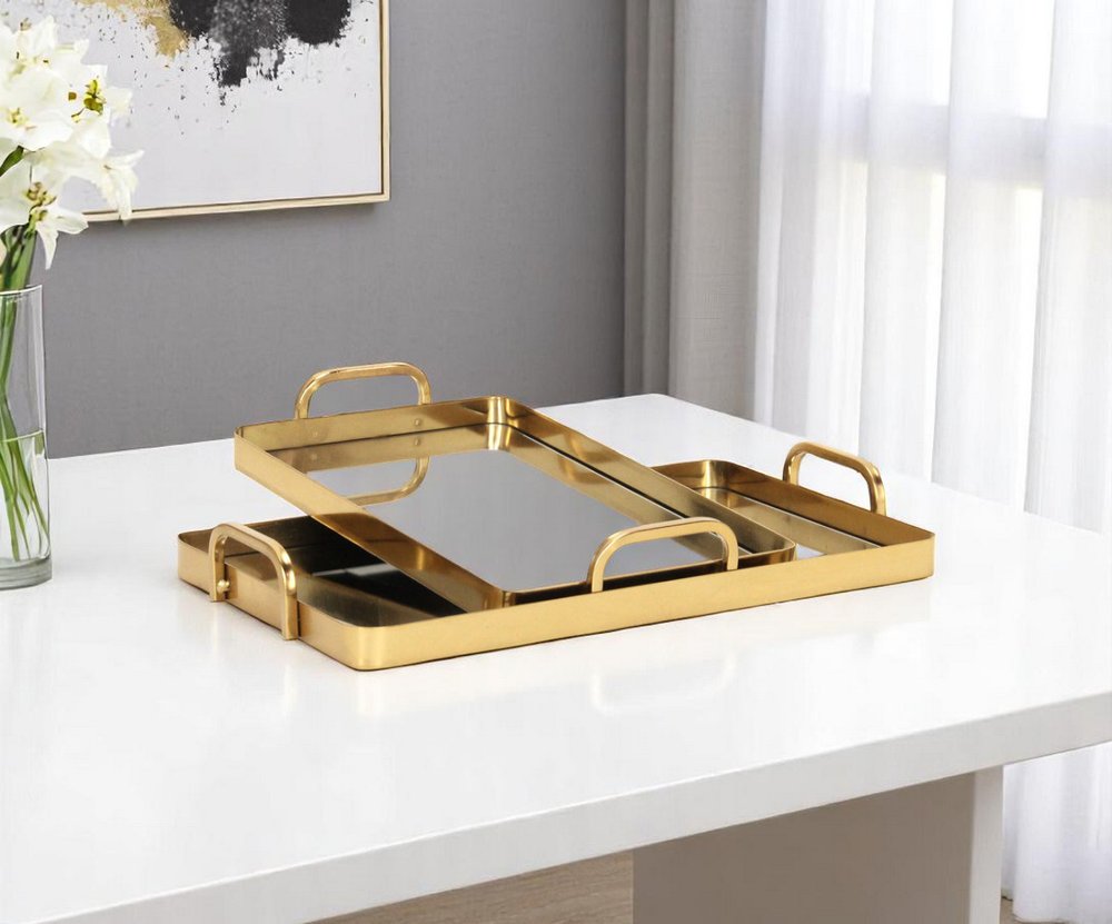 Set of Two Gold And Mirrored Glass Handmade Serving Trays on a white background