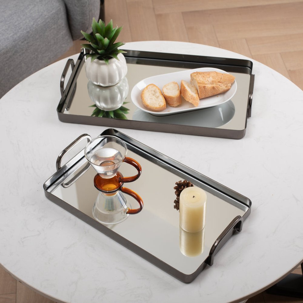 Set of Two Pewter Aluminum And Mirrored Glass Handmade Serving Trays in a home interior