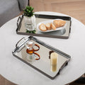 Set of Two Pewter Aluminum And Mirrored Glass Handmade Serving Trays in a home interior