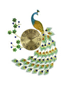 Gold, blue, and green metal peacock wall clock with a white background.