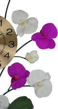 Gold analog clock face with black numbers and purple and white orchid accents on a white background.
