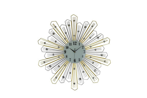 Gold and silver sunburst wall clock with faux crystals on a white background.