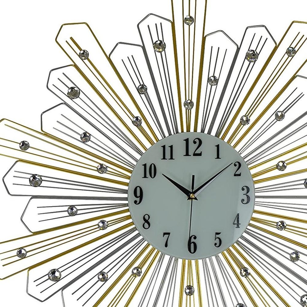 27" Gold Silver And Metal And Faux Crystals Silent Analog Sunburst Wall Clock. Wall clock isolated on a plain white background, showing a silver crystal surface.