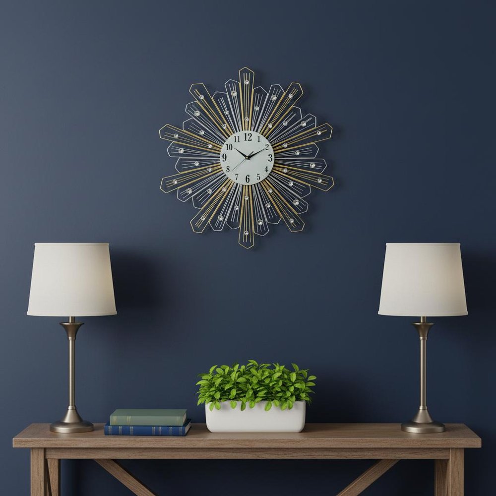 27" Gold Silver And Metal And Faux Crystals Silent Analog Sunburst Wall Clock shown outdoors on an outdoor setting.