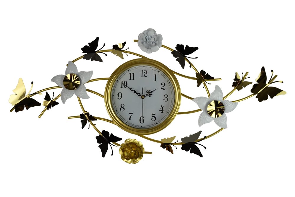 Gold and white metal wall clock with butterfly and flower accents on a white background.