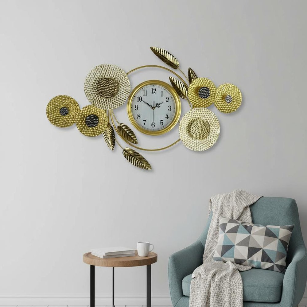 37" Gold Silver And White Metal Silent Analog Floral Novelty Wall Clock styled in a furnished interior with a light gray wall on a tiled floor.