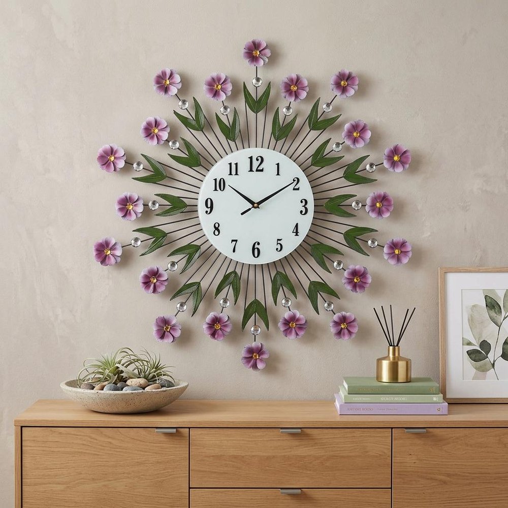 27" Purple Green And White Metal and Glass Silent Analog Floral Round Wall Clock styled in a furnished interior with a cream wall on a dark wood floor.