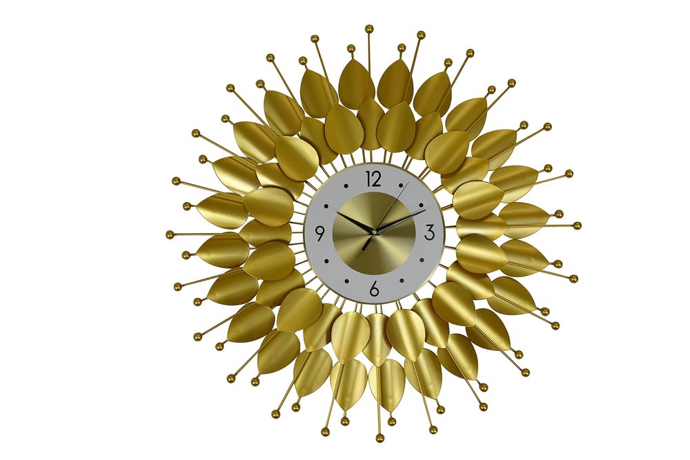 Gold and white metal analog floral sunburst wall clock on a white background.