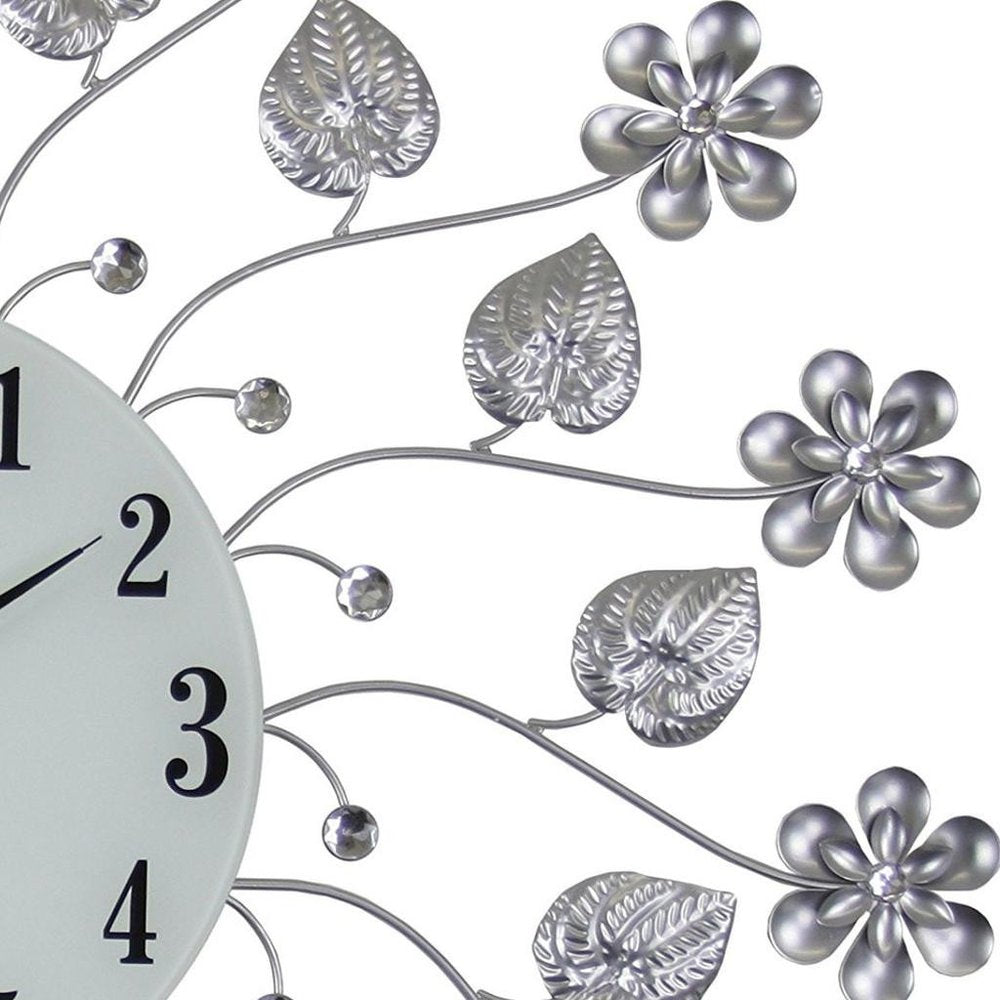 27" Silver White And Black Metal and Glass Silent Analog Floral Round Wall Clock. Wall clock isolated on a plain white background, finished in silver glass.