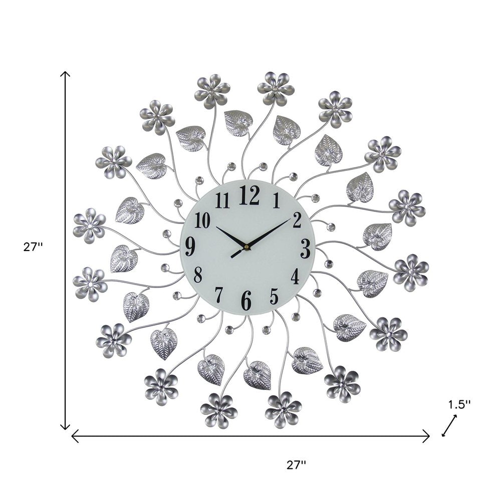 27" Silver White And Black Metal and Glass Silent Analog Floral Round Wall Clock. Wall clock isolated on a plain white background, showing a silver glass surface.