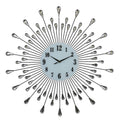 A 27-inch silver and white metal silent analog round wall clock with a sunburst design and crystal accents on a white background.