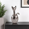 11" Silver Aluminum Cat Tabletop Sculpture. Sculpture in silver metal.