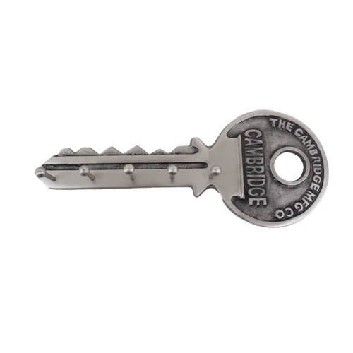 Silver key-shaped wall mount with five hooks and "The Cambridge Mfg. Co." text on a white background.