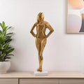 24" Gold And White Aluminum And Marble Woman Tabletop Sculpture. Sculpture in gold metal.