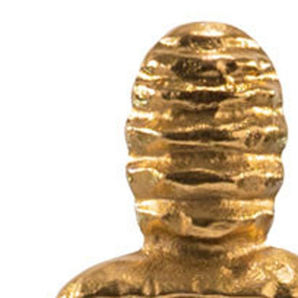 21" Gold And White Aluminum And Marble Mummy Tabletop Sculpture. Sculpture isolated on a plain white background, showing a gold metal surface.