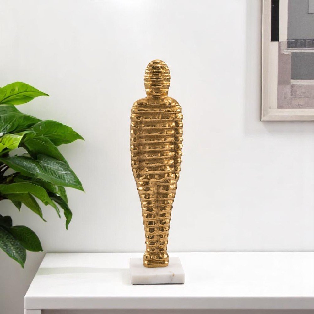 21" Gold And White Aluminum And Marble Mummy Tabletop Sculpture. Sculpture in white metal.