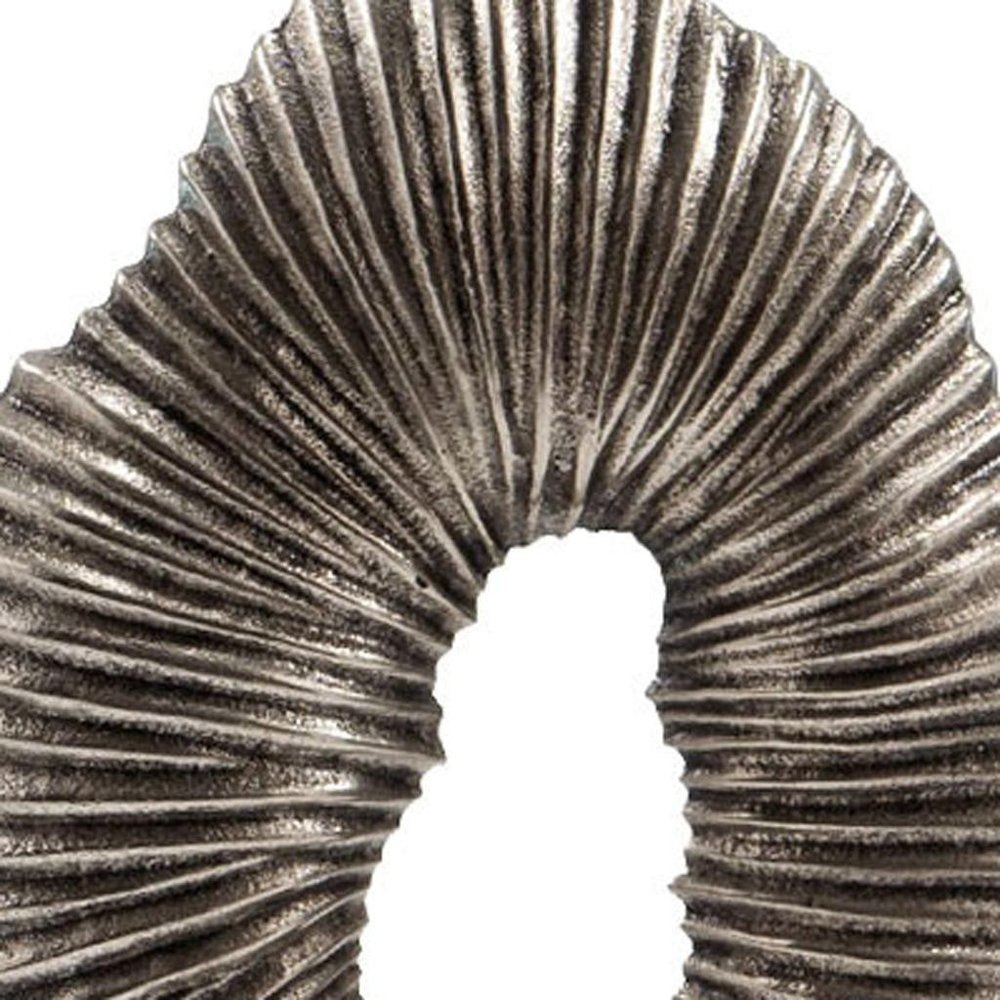 17" Silver And White Aluminum And Marble Tabletop Sculpture. Sculpture isolated on a plain white background, showing a metal surface.