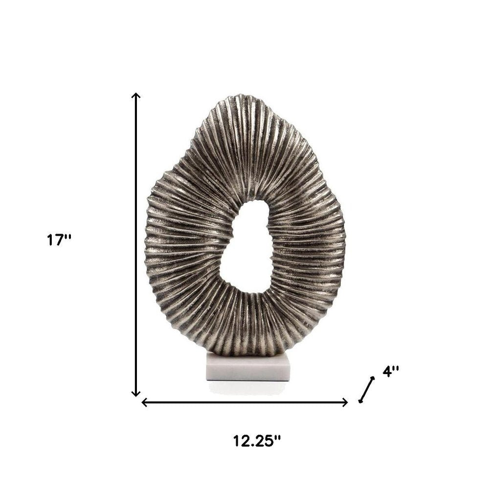 17" Silver And White Aluminum And Marble Tabletop Sculpture. Sculpture isolated on a plain white background, showing a silver metal surface.