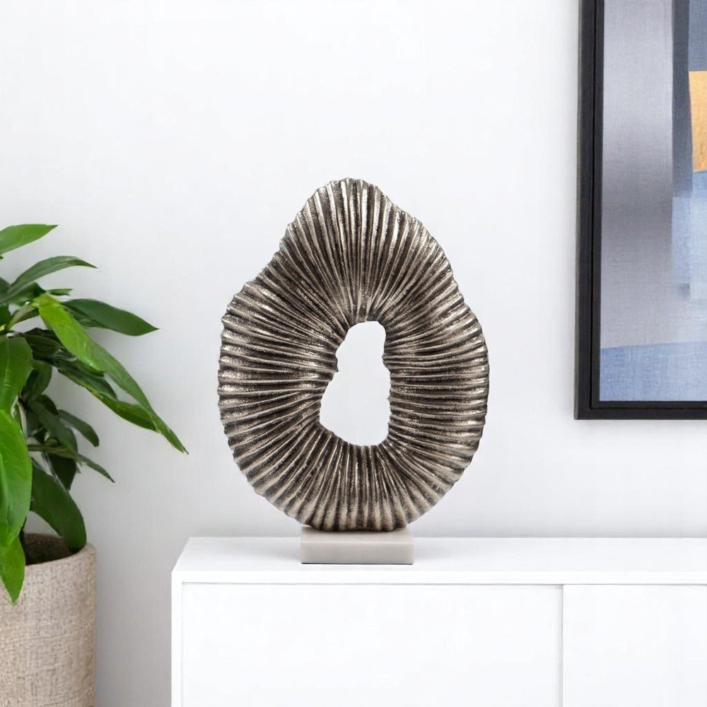 17" Silver And White Aluminum And Marble Tabletop Sculpture. Sculpture isolated on a plain white background, finished in silver metal.