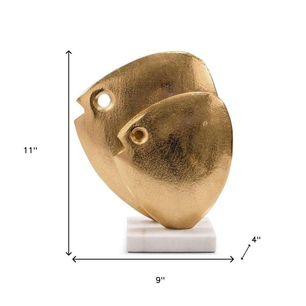 11" Gold And White Aluminum And Marble Fishes Tabletop Sculpture. Sculpture isolated on a plain white background, showing a gold metal surface.