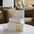 Set Of Two White And Gold Wood Jewelry Boxes in a home interior