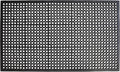 Black rubber outdoor door mat with a pattern of circular holes and a beveled edge.