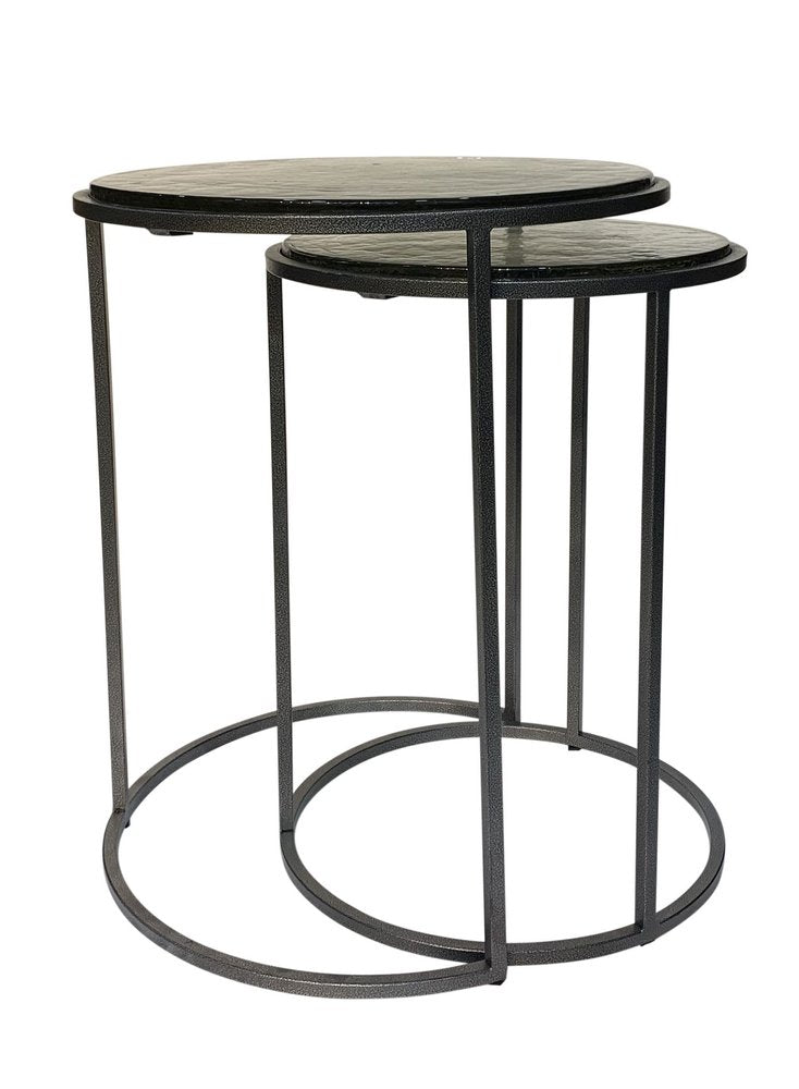 Set of Two Clear and Gunmetal Glass and Iron Round Frame Nested Tables on a white background