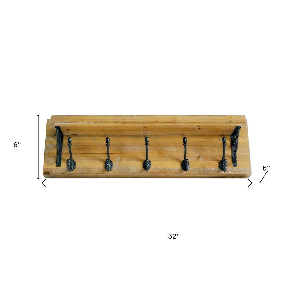 6" Black And Brown Metal And Solid Wood Five Hook Wall Mount Coat Rack. Coat hanger isolated on a plain white background, showing a brown wood surface.