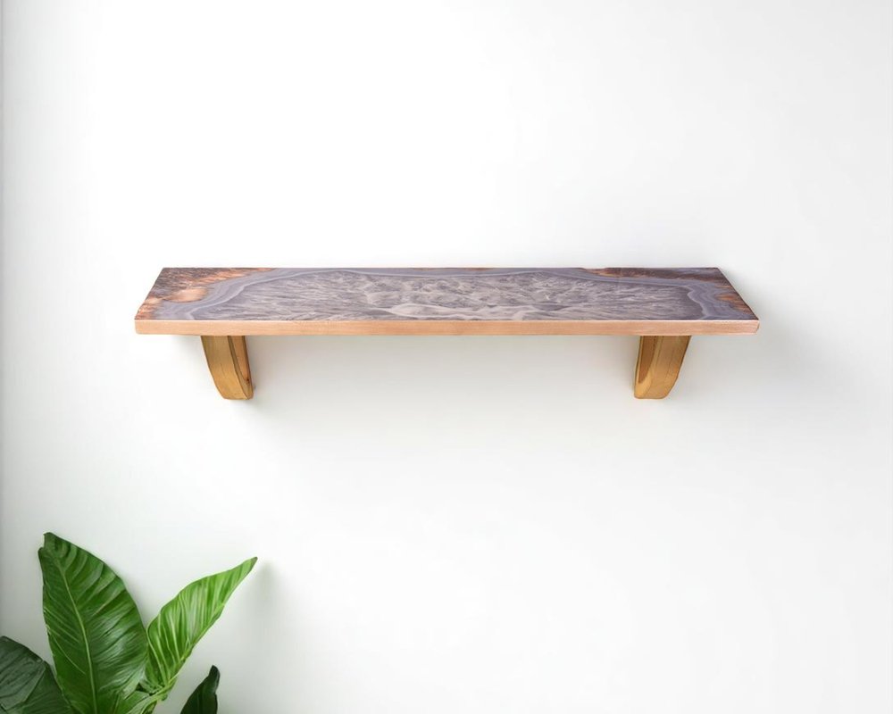 24" Gray And Natural Wood Wall Mounted Accent Shelf. Wall mounted shelve isolated on a plain white background, showing a gray wood surface.
