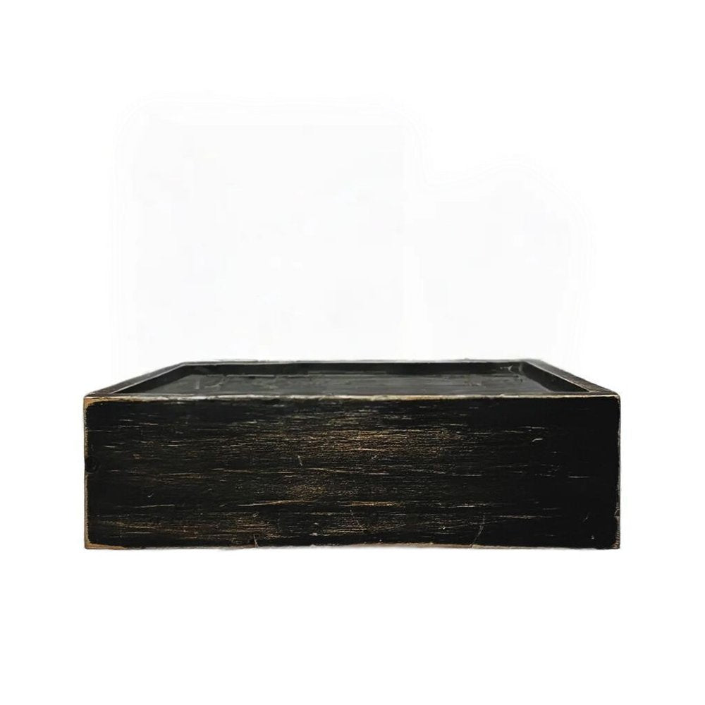 Black distressed wood wall mounted floating shelf against a white background.