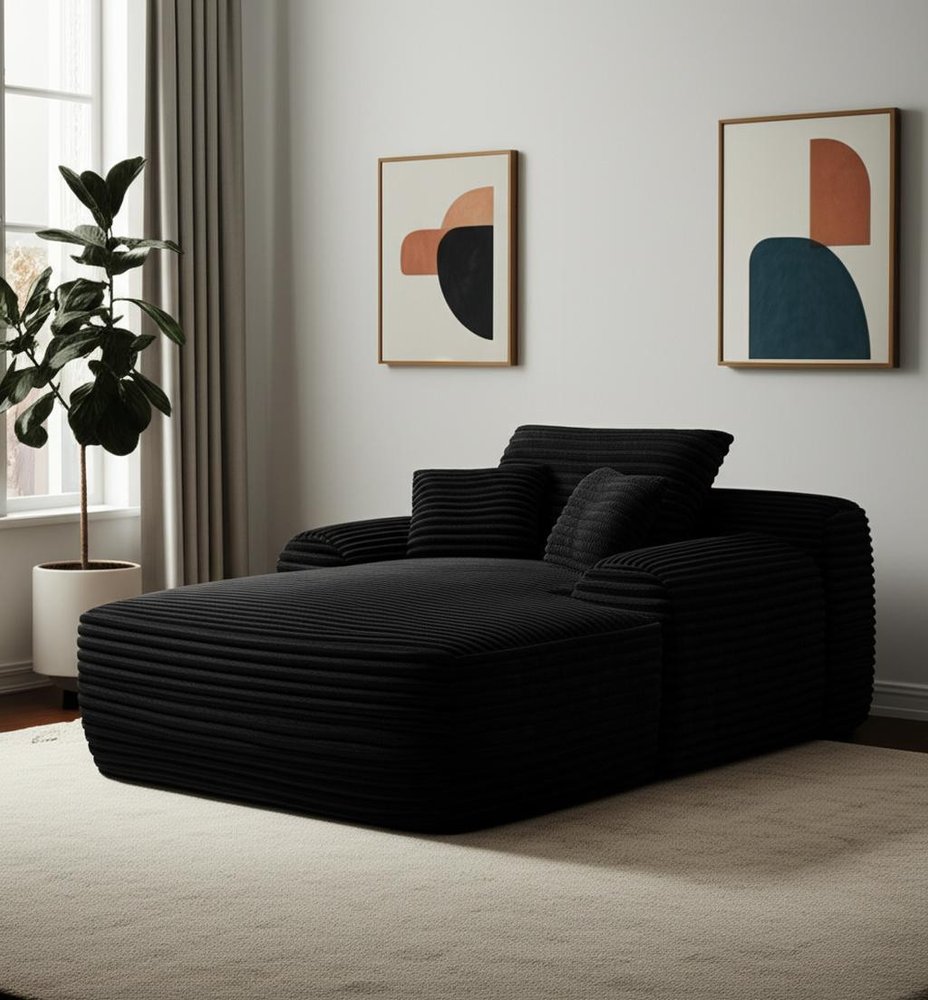 67" Black Corduroy Oversized Chaise Lounge Chair And Toss Pillows styled in a furnished interior on a wood floor against a light gray wall.